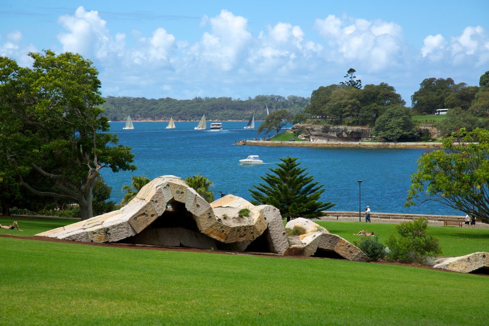 View of abstract sculpture on a grassy hill at the Royal Botanic Gardens