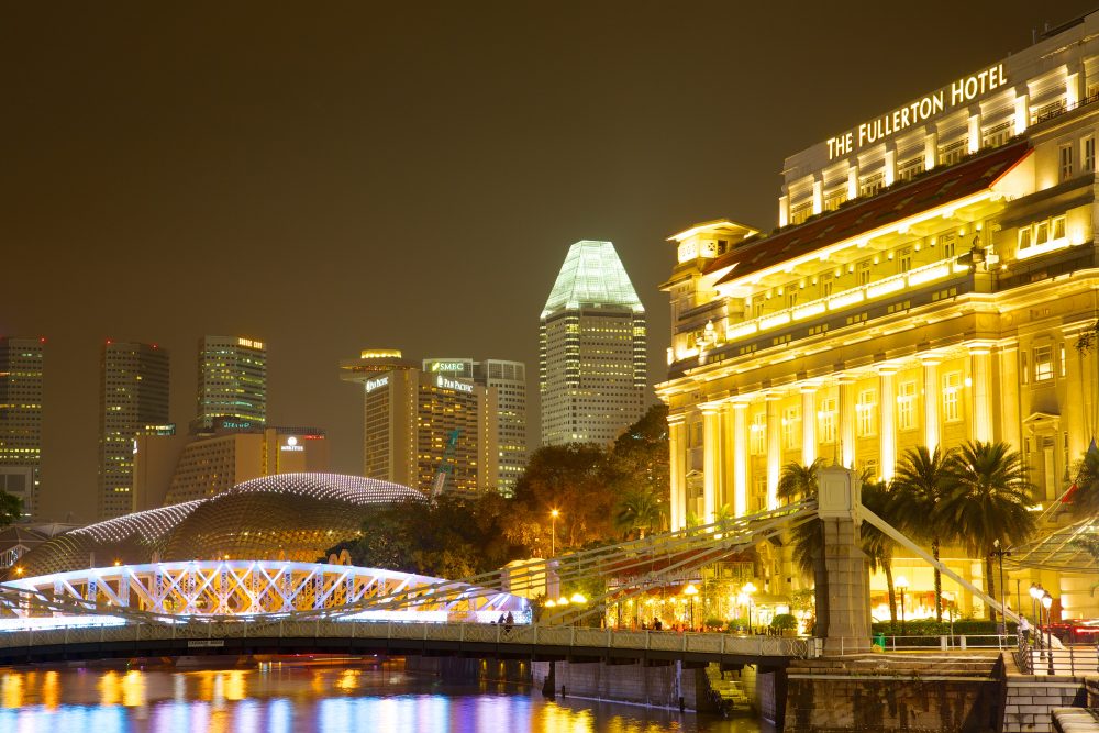 Nightime view of the city skyline from Boat Quay
