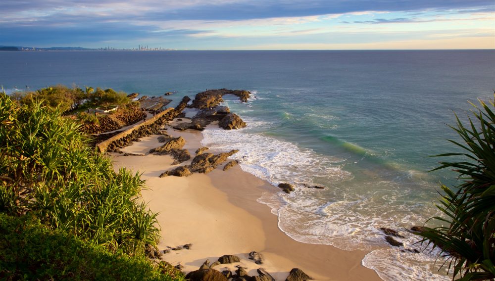 An aerial view of Snapper Rocks with its rocky outcrop and famous surf