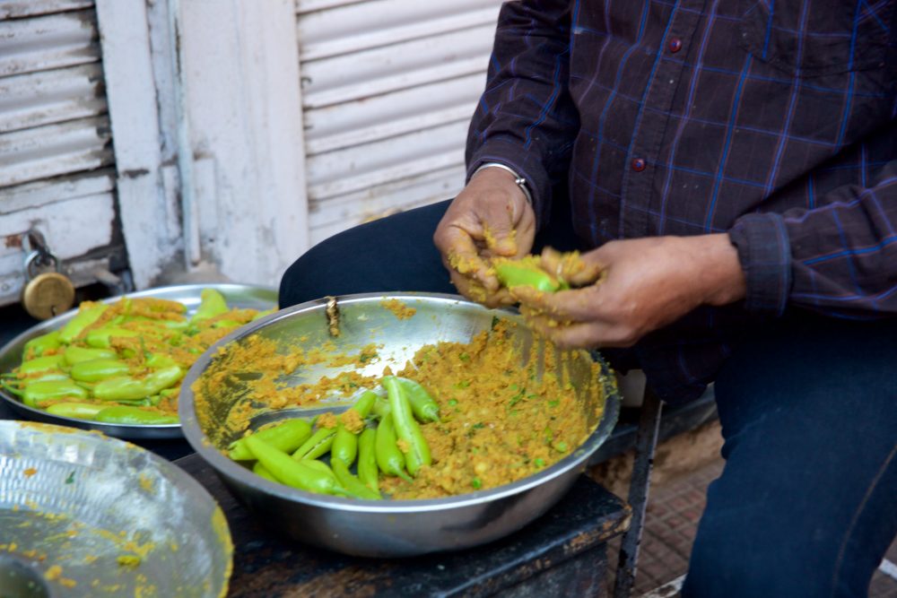 Preparing peppers in Udaipur, India
